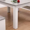 A close-up view of a table leg and part of the tabletop, with a rose placed on the table. Produktbild-Vorschau