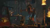 A scene from LEGO The Hobbit video game, showing characters in a dimly lit, rustic environment with torches and wooden structures. Produktbild-Vorschau