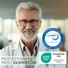 A man in a lab coat smiles at the camera, with certifications and text overlays on the right and bottom of the image. Produktbild-Vorschau