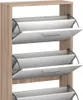 A close-up view of a wooden shoe cabinet with multiple flip-out compartments. Produktbild-Vorschau