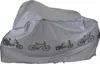 A silver motorcycle or bicycle cover with graphics of various bikes printed on it. Produktbild-Vorschau