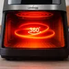 Close-up view of the interior of a Lehmann air fryer, with a glowing red heating element and a "360°" graphic indicating rotation. Voir les images du produit