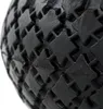 A close-up view of the textured surface of a black rubber tire. Anteprima dell’immagine prodotto