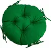 A round green cushion with ties, shown from a top-down angle. Produktbild-Vorschau