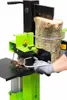 A person is using a log splitter to split a piece of wood. Voir les images du produit