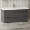 A modern bathroom vanity with a dark gray cabinet and a white countertop, mounted on a tiled wall. Produktbild-Vorschau
