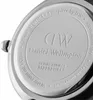 Close-up of the back of a Daniel Wellington watch, showing engraved text and logos. Voir les images du produit