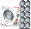 The image shows the packaging of a set of LED downlights, with one light fixture prominently displayed on the left and several others stacked on the right. The packaging includes product specifications and a family photo. Voir les images du produit