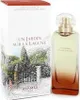 A perfume bottle and its packaging are displayed together. Voir les images du produit