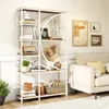 A white and wood tone bookshelf filled with decorative items and books, placed in a living room next to a sofa. Produktbild-Vorschau