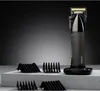 A professional studio shot of a hair clipper and its accessories on a textured surface with a gradient background. Produktbild-Vorschau