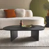 A modern living room scene featuring a sofa, coffee table, and rug. Produktbild-Vorschau