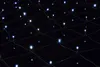 A close-up view of a net of white LED lights against a black background. Produktbild-Vorschau