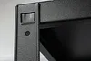 A close-up view of a black metal shelf unit's corner and support beam. Produktbild-Vorschau