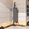 A boxing bag and stand in a gym or workout room. Produktbild-Vorschau