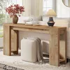 A console table with decorative items and a sofa in the background, in a living room setting. Produktbild-Vorschau