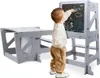 A child is drawing on a chalkboard attached to a learning tower. Produktbild-Vorschau