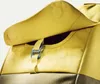 A close-up view of the top flap and buckle of a yellow backpack. Náhled obrázku produktu