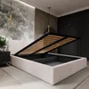 A modern bedroom with a bed that has its storage compartment open. Produktbild-Vorschau