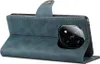 A blue leather flip case for a smartphone is shown from the side, with the case open to reveal the phone's camera module. Podgląd zdjęcia produktu