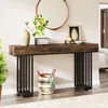 A console table with decorative items on top and a basket underneath, placed in a hallway or entryway. Náhľad obrázku produktu