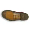 The underside of a brown Dr. Martens boot. Produktbild-Vorschau