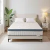 A mattress on a bed frame in a bedroom setting. Náhled obrázku produktu