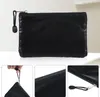 A black mesh pouch with a zipper and a small wrist strap is shown from different angles. Produktbild-Vorschau