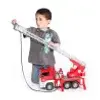 A young boy is playing with a Bruder MAN fire engine toy with a extendable ladder. Anteprima dell’immagine prodotto