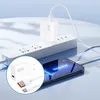 A white 45W charger is plugged into a white power strip, with a white USB-C cable connecting to a smartphone. Produktbild-Vorschau
