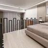 A modern bedroom with a railing and a bed. Náhľad obrázku produktu