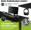 A black desk with a computer monitor, keyboard, mouse, and headphones, highlighting cable management features. Náhled obrázku produktu