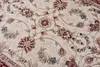 A close-up view of a patterned rug with floral motifs. Náhľad obrázku produktu