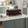 A wooden wine rack filled with bottles of wine sits on a kitchen counter. Podgląd zdjęcia produktu