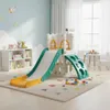 A children's indoor playground set in a brightly lit room with a bookshelf and a small table with chairs. Náhľad obrázku produktu