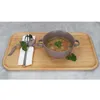 A soup bowl and cutlery set on a wooden tray. Produktbild-Vorschau