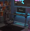 A gaming setup with a chair, desk, computer, and accessories in a room with ambient lighting. Produktbild-Vorschau