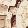 A close-up view of a wooden 3D puzzle, showing engraved numbers and text. Anteprima dell’immagine prodotto