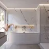 A modern bathroom featuring a white bathtub, marble-patterned walls, and a shower enclosure. Produktbild-Vorschau
