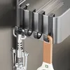 Close-up of kitchen utensils hanging on hooks attached to a shelf. Anteprima dell’immagine prodotto