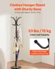 A black coat rack with clothes, a purse, and an umbrella is shown in a room corner. Anteprima dell’immagine prodotto