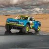 A remote-controlled truck in a desert-like environment. Produktbild-Vorschau