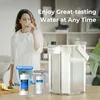 A woman drinks water next to a water filter pitcher, with comparison images of old and new packaging for water filters. Anteprima dell’immagine prodotto