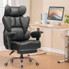 A black ergonomic gaming chair is shown in a home office setting next to a desk with a computer. Voir les images du produit