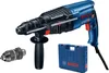 A blue and black Bosch hammer drill with accessories and a blue carrying case, presented on a white background. Náhled obrázku produktu