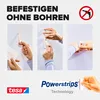 Collage of three images showing how to use tesa Powerstrips to attach something to a wall without drilling, with branding at the bottom. Náhled obrázku produktu
