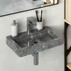 A close-up view of a modern bathroom sink with a faucet, soap dispenser, and toothbrush holder. Náhled obrázku produktu