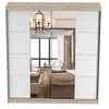 A sliding door wardrobe with mirrored panels reflecting a bedroom. Voir les images du produit