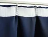 Close-up view of navy blue curtains hanging from a white curtain rod. Náhľad obrázku produktu