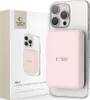 A pink Tech-Protect Lifemag Magsafe power bank is attached to the back of a silver smartphone, with its packaging box visible to the left. Náhled obrázku produktu